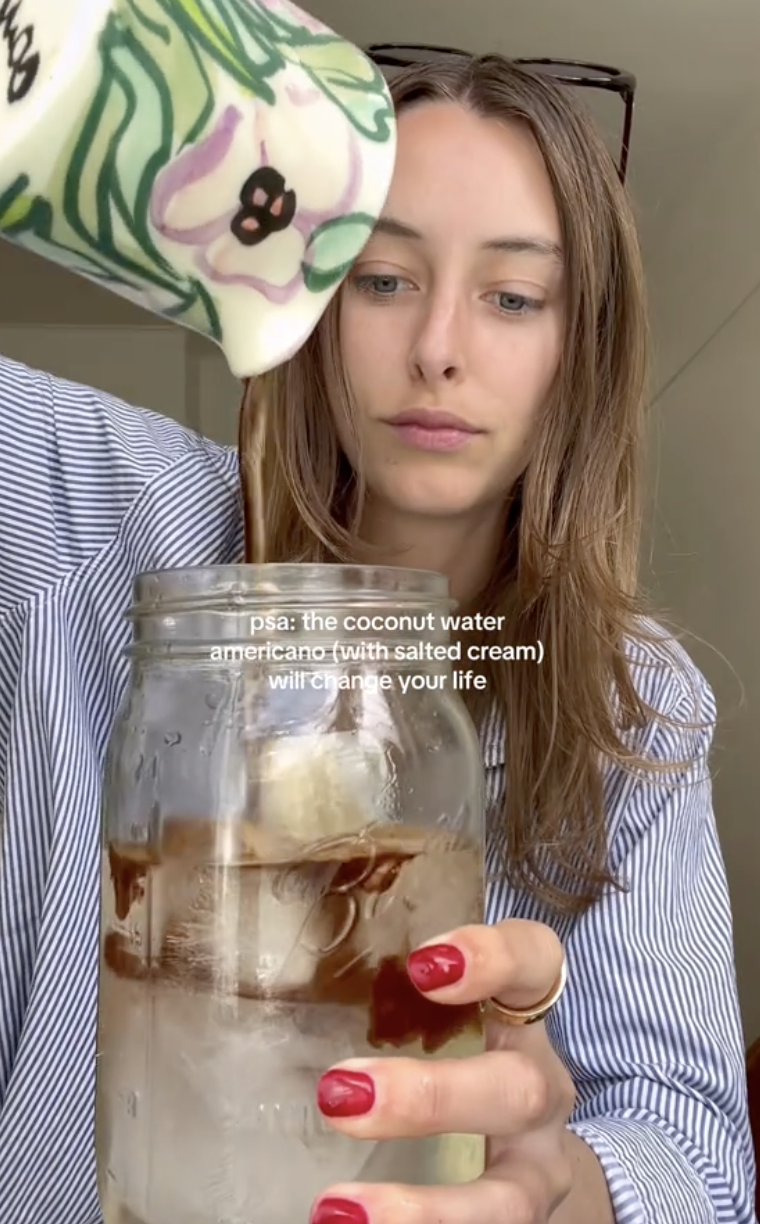 woman pouring coffee into a jar